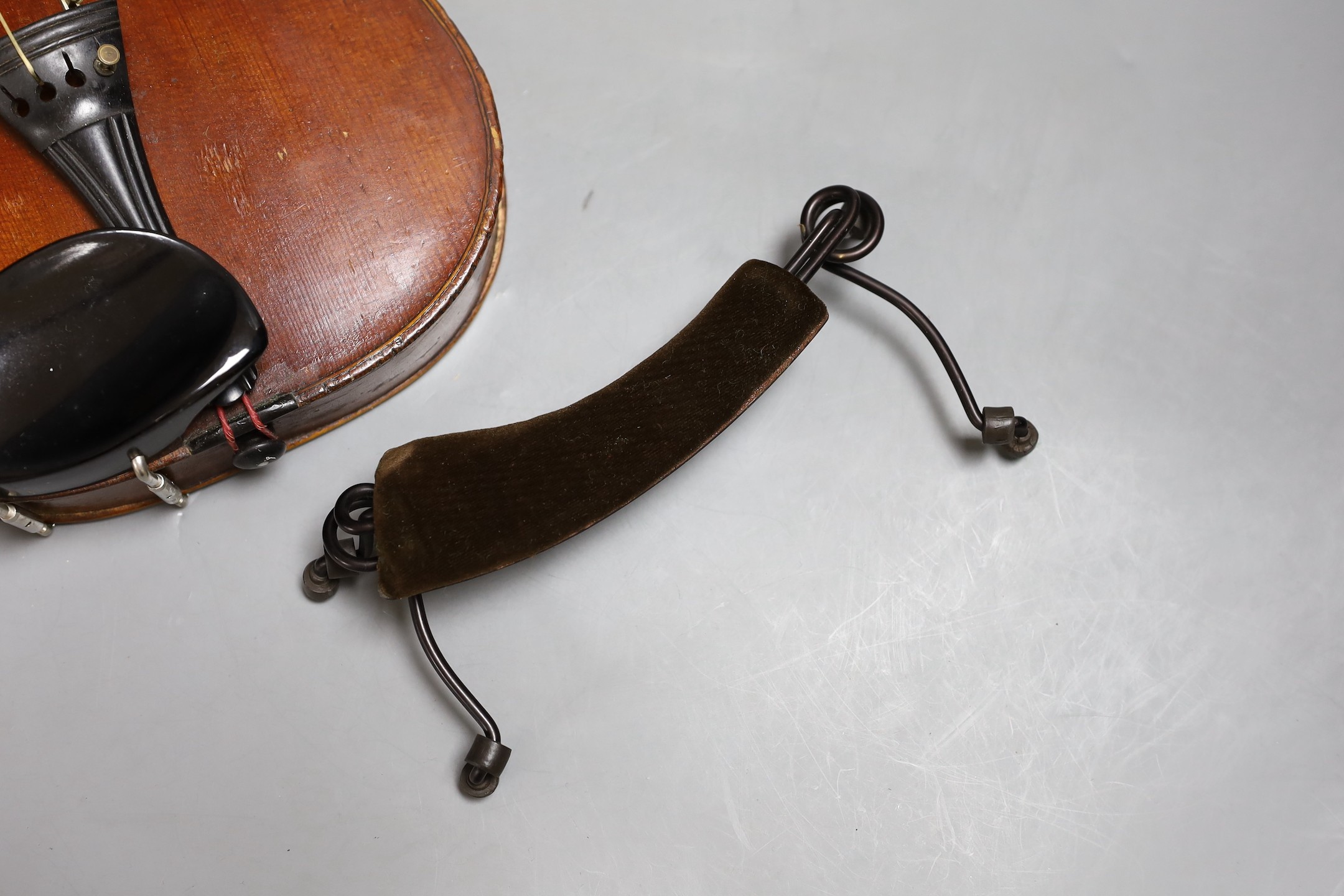 A cased late 19th century English violin, inscribed W. Heaton maker 1887 (?), back measures 35.5cm excl button